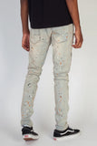 RIPPED MOTO JEANS WITH MULTI-PAINT SPLATTER